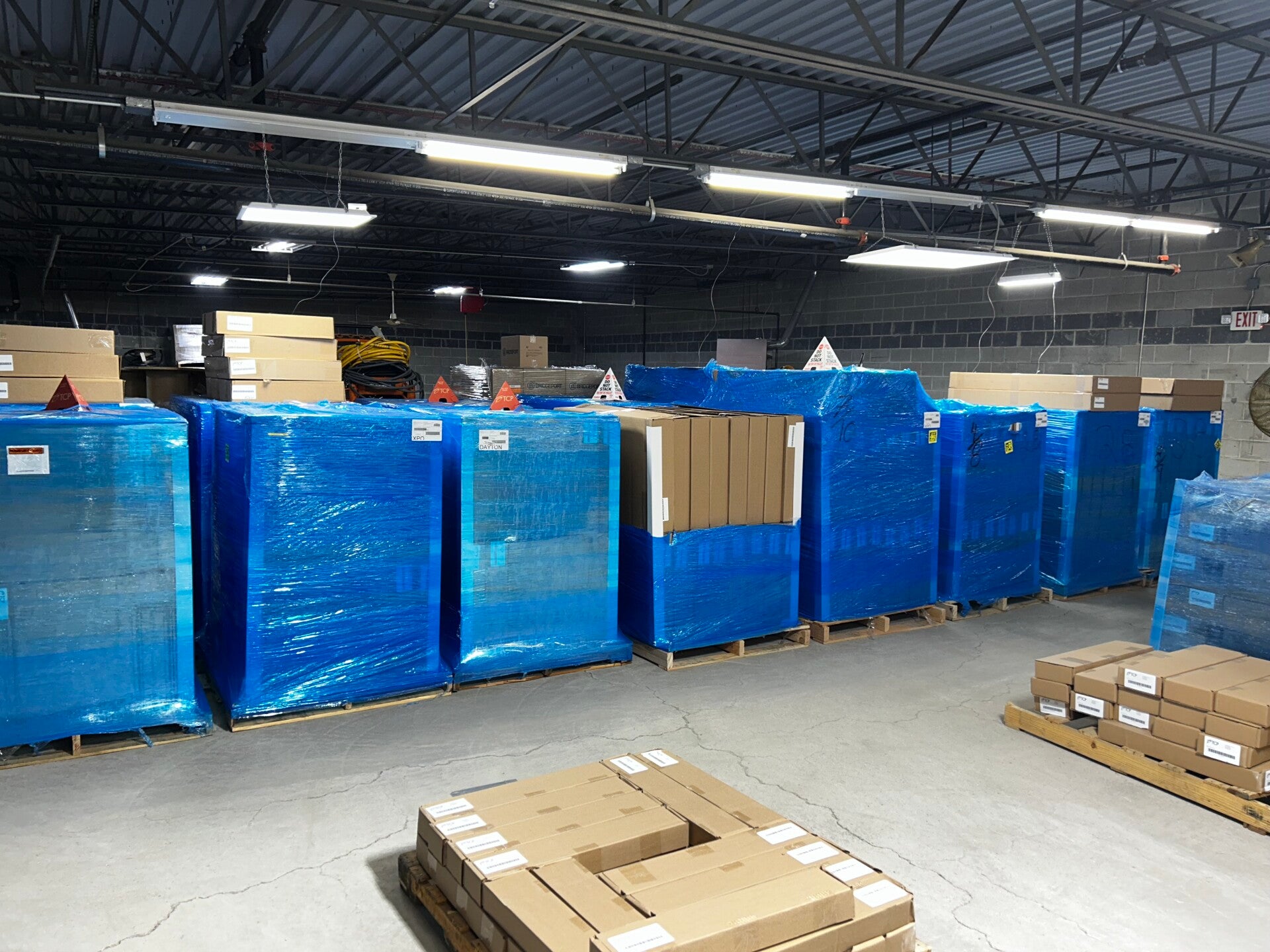 Palletized lighting stock on the warehouse floor